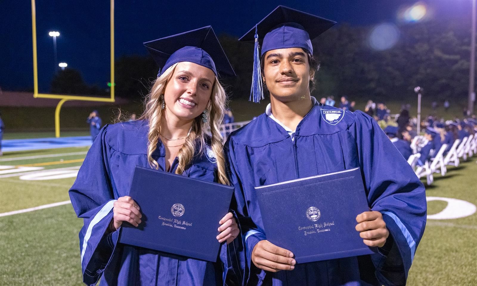 graduates smile